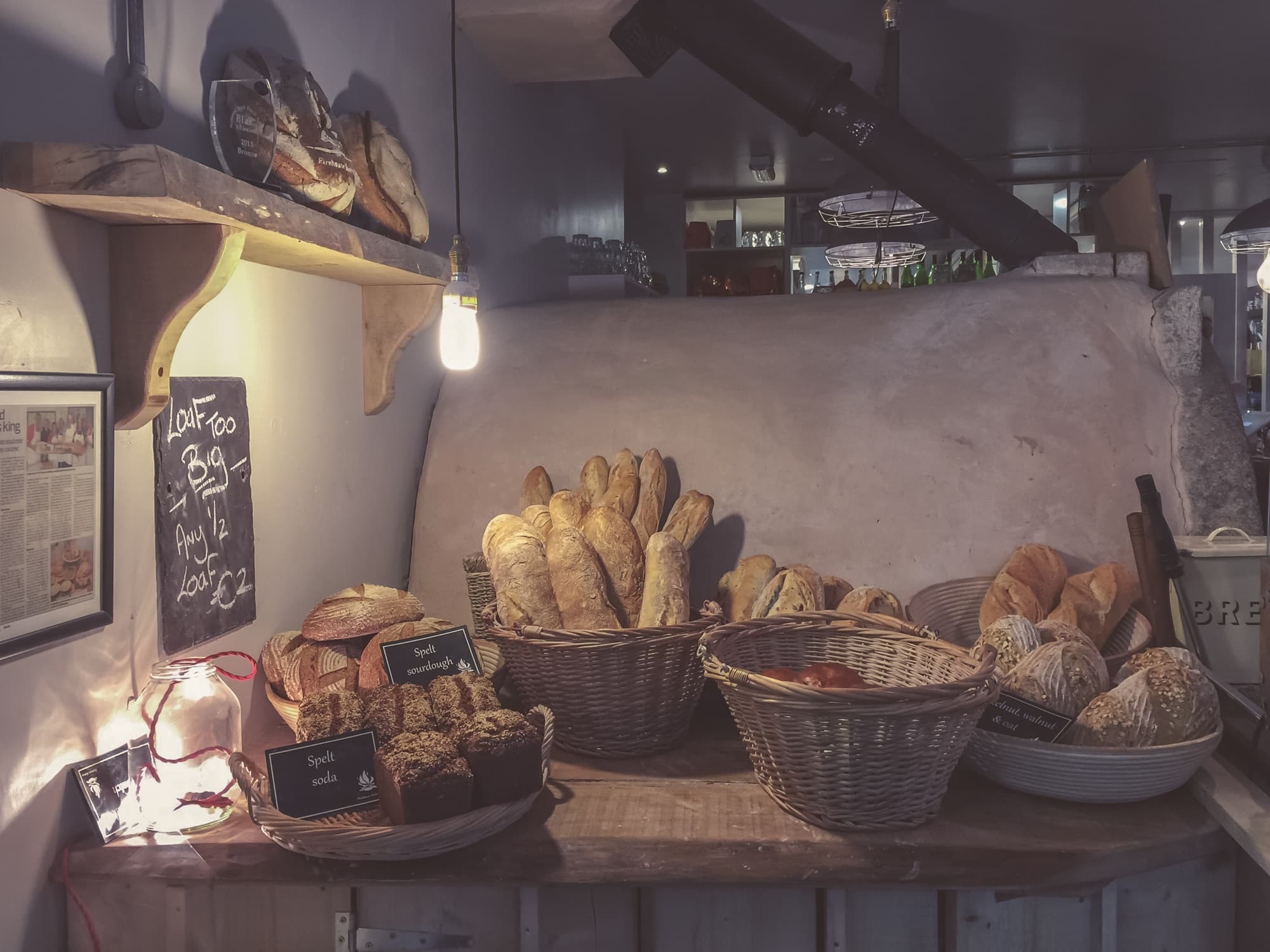 An assortment of artisan bread loaves on a table.
